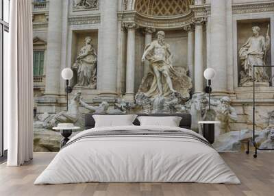 Trevi fountain in Rome, Italy. Facade and a close full view towards a famous Baroque fountain. Watter, sculptures and architecture constitute the background. Wall mural