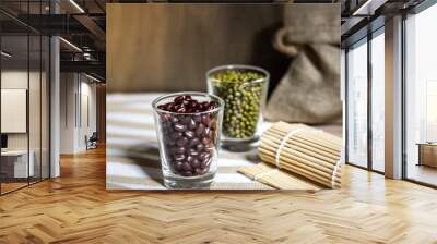 Cereals in glass cups placed on a wooden background Wall mural