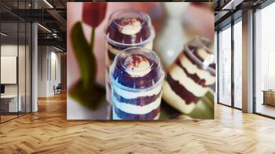 Selection of decorative desserts on buffet table at catered event Wall mural