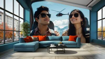 A couple smiles as they take in breathtaking mountain views during their helicopter adventure Wall mural