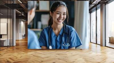 A healthcare professional enjoys a light moment with a colleague in a modern clinic Wall mural