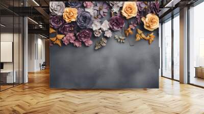 Top border of colorful paper flowers and gold leaves on a dark gray background, creating a festive and elegant floral arrangement. Wall mural