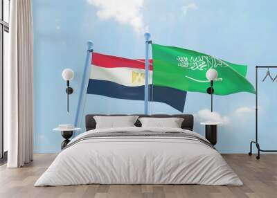 Saudi Arabia and Egypt, two flags waving against blue sky. 3d image Wall mural