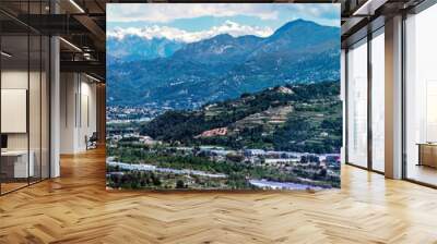 Panoramic view of Var Valley from Saint Laurent du Var village, the suburb of Nice city. Mountains of Mercantour National Park isa at background. French Riviera. Wall mural