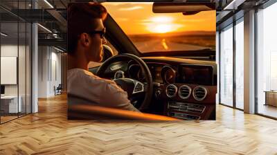 Modern businessman driving a luxury car on a sunny summer day Wall mural