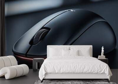 Sleek black wireless mouse on modern desk. Wall mural