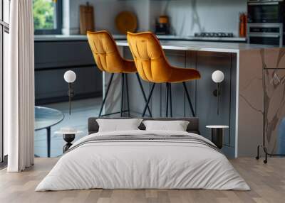 Two modern orange bar stools in a contemporary kitchen setting Wall mural