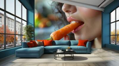 Young woman biting a fresh carrot, close-up. Wall mural