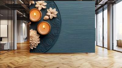 A blue background with two candles and two flowers Wall mural