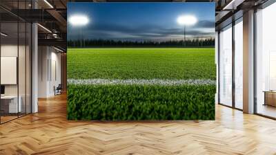 football field under bright stadium lights at sunset, showcasing the vibrant green turf and white line marking in the center, creating a dynamic sports scene.
 Wall mural