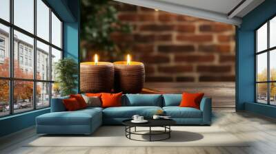 Two candles are lit on a wooden table. The candles are placed on a colorful rug. The scene has a warm and cozy atmosphere Wall mural