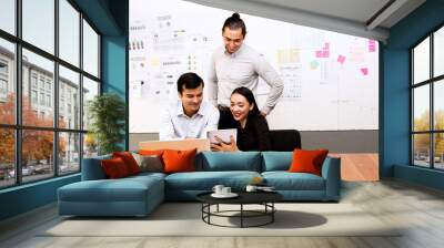 Future business leader concept. Group of young business team discussing work together in modern office. Wall mural