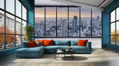 Empty interior space with skyscraper city view in sunrise through window Wall mural