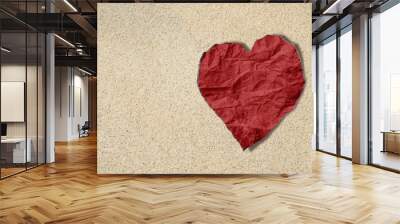 Red heart crumpled paper on sand texture, beach lover texture background Wall mural