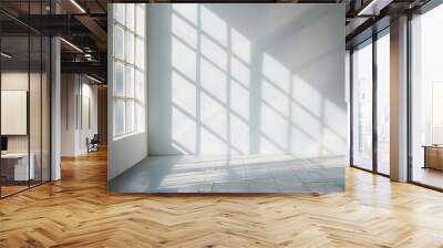 A bare window frame letting in a flood of natural light, casting geometric patterns on an otherwise empty floor, a celebration of light and space. Wall mural