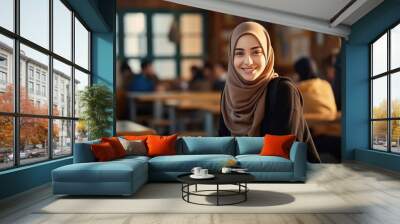 Back to school. Middle eastern muslim school female teenage student posing at the classroom looking at the camera Wall mural