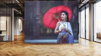 Beautiful Thai woman in Traditional Thai dress Wall mural