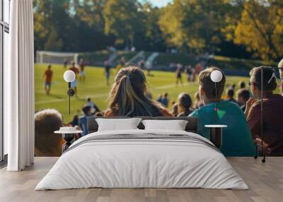 Spectators watching a soccer game from the bleachers Wall mural