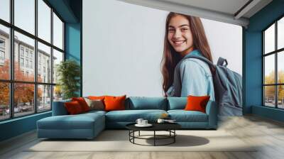 Young happy student with backpack on white Wall mural