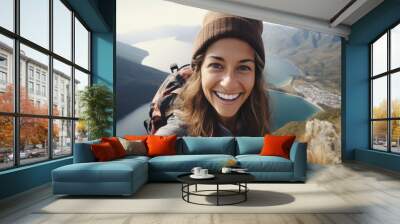 Young hiker woman taking selfie portrait on the top of mountain - Happy guy smiling at camera - Tourism, sport life style and social media influencer concept Wall mural