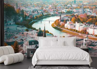 Banner travel with  panoramic view in a Autumn season at a historic city of Salzburg with Salzach river in beautiful golden evening light sky and colorful of autumn at sunset, Salzburger Land, Austria Wall mural