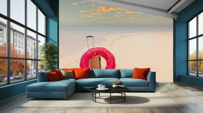 Banner with  sunset sky scene in summer tropical with the luggage and swim ring on the beach- summer travel concept Wall mural