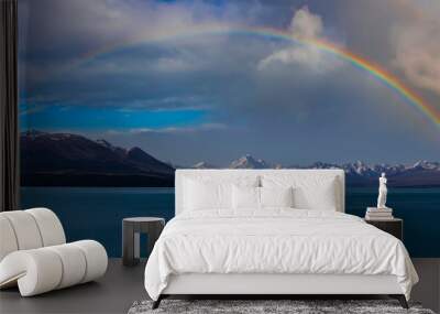 Rainbow scene with mountain view of  alpine as snow-capped mount peaks and blue lake in Winter mountains, panorama scene Wall mural