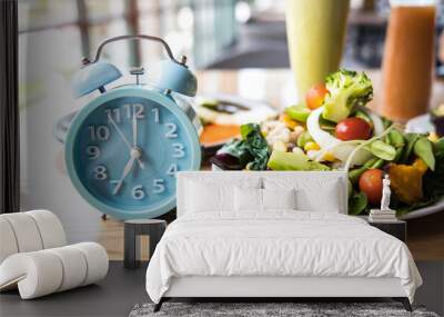 Selective focus with Blue clock breakfast time and Intermittent fasting ,Lifestyle concept. Wall mural