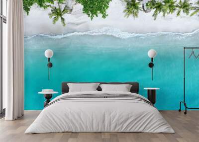 Top view of beautiful tropical beach which summer  Amazing Sandy coastline and white turquiose sea waves. As Aerial view of white sand beach and water surface texture, foamy waves Wall mural