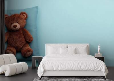 Teddy bear curled up on a pillow, soft pastel background, 3D illustration Wall mural