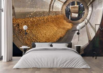 Golden wheat grains sorting, drying and peeling in the machine Wall mural