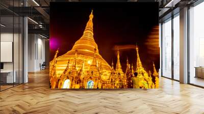 The golden pagodas and mondops are illuminated in the light of the night Wall mural