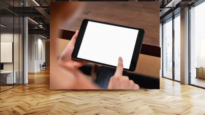 Mock up of woman hand holding digital tablet and touching blank screen. Wall mural