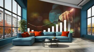 Businessman pointing to a chart showing the highest profitability target for the last month of the year with monthly earnings chart, marketing or finance concepts. Wall mural