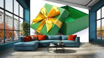 Open green gift box tied with yellow ribbon isolated on white background. Clipping path silhouette Wall mural