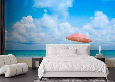 Beach chairs with umbrella and sand beach in summer. Wall mural