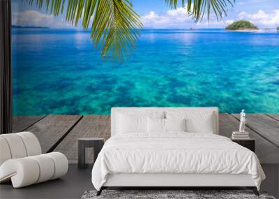 Wooden floor or plank on sea in summer. For product display.Calm Sea and Blue Sky Background. Wall mural