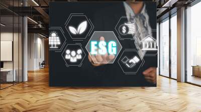 ESG environment social governance investment business concept, Businesswoman hand touching ESG icon on screen display, social and corporate governance concept Wall mural