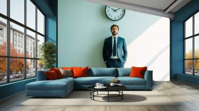 Businessman standing with clock on the wall . Wall mural