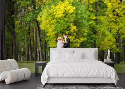 Beautiful Romantic Wedding Couple  Kissing and Embracing Outdoors Wall mural