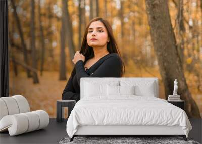 Close up portrait of pretty indian young woman enjoying warm autumn sunny day vacation outdoors copy space mockup. Generation z and gen z concept. Fall Season Wall mural