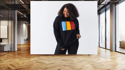 Youth street fashion concept - Portrait of confident sexy black woman in stylish sweatshirt on white background. Wall mural