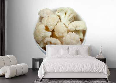 Frozen cauliflower florets in a bowl isolated on white backgroung, top view Wall mural