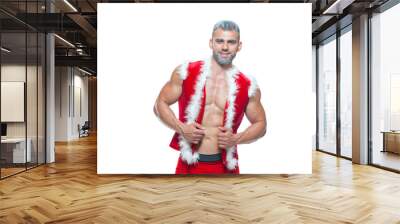 Sexy Santa Claus . Young muscular man wearing Santa Claus hat demonstrate his muscles. Isolated on white background. Wall mural