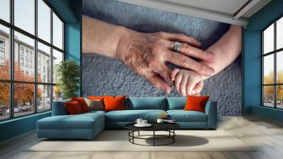 grandmother holds the hand of his beloved grandson Wall mural