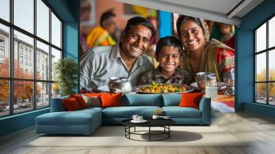 A happy indian family having lunch.	 Wall mural