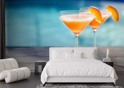 Bellini cocktail with peach isolated near pool Wall mural