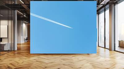 Background with airplane with jet stream in the sky Wall mural