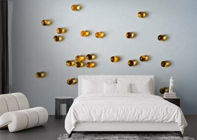 Background with capsules of cod liver oil Wall mural