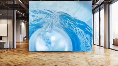 Narrow background with a swirl of blue clear water Wall mural